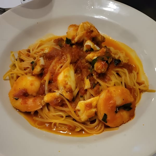 Carino's Northern Italian Cuisine's shrimp scampi with linguine pasta and red sauce.
